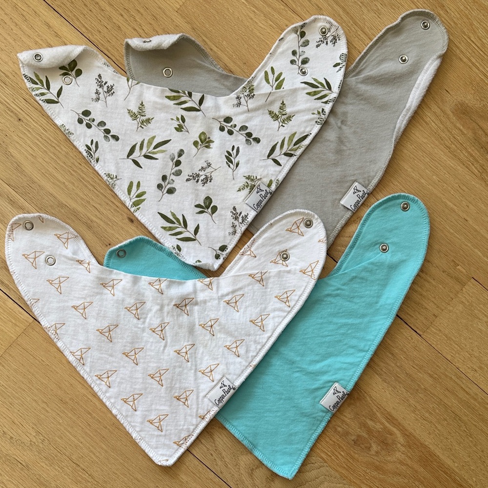 Set of four Copper Pearl baby bandana bibs.